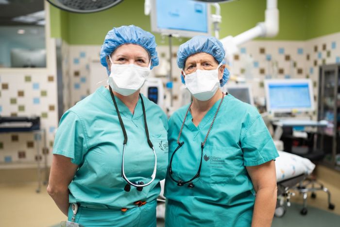 Orthopedic surgeons, Deborah Bohn, MD and Ann Van Heest, MD often do surgeries together on the same child, they pose for photo at Gillette Children's.